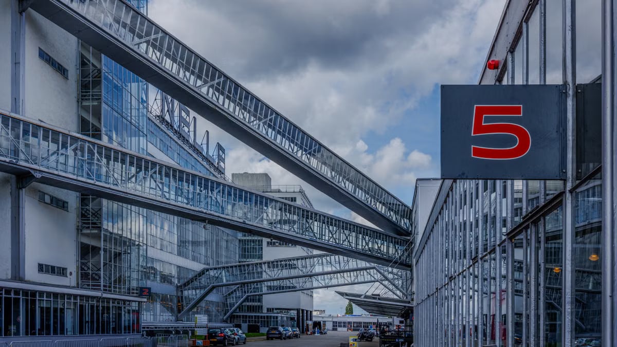 Explore the iconic Van Nelle Factory's industrial architecture in Rotterdam, Netherlands.
